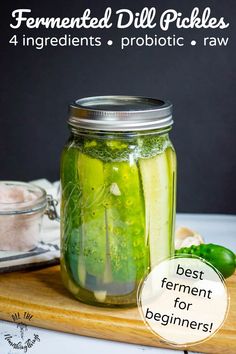 pickles in mason jars with text overlay that reads ferment dill pickles 4 ingredients probiotic - raw best ferment for beginners