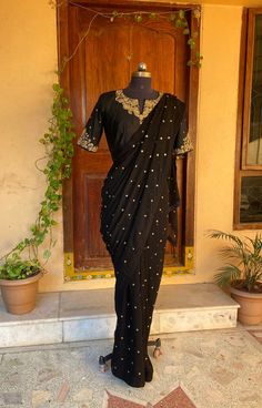 black buti saree with heavy embroidered pure silk blouse | silk saree with blouse | designer modern party sequin saree | simple light weight saree blouse | zardosi work blouse | sarees USA | black georgette hand embroidered saree with blouse           so bored of regular saree styles ? Then You really deserve to own this unique stylish saree look for your upcoming occassion that really makes you stand apart in crowd !!           Presenting this beautiful georgette saree in beautiful black color Semi-stitched Black Art Silk Blouse Piece, Elegant Black Pre-draped Saree With Zari Work, Designer Art Silk Black Blouse Piece, Designer Black Art Silk Blouse Piece, Traditional Drape Pre-draped Saree With Dabka Work, Black Art Silk Saree For Wedding, Fitted Pre-draped Saree With Dabka Work For Party, Black Semi-stitched Art Silk Blouse Piece, Elegant Black Chanderi Saree