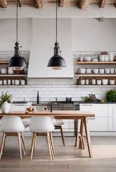 the kitchen is clean and ready to be used for dinner or lunchtime, with white walls and open shelving