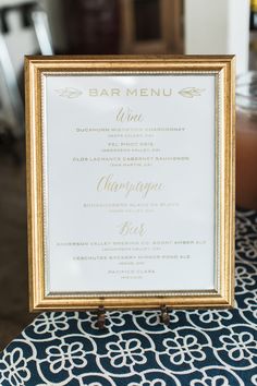 a menu sitting on top of a blue and white table cloth