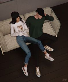 two people sitting on a couch with shoes