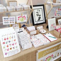 the table is covered with cards and pictures