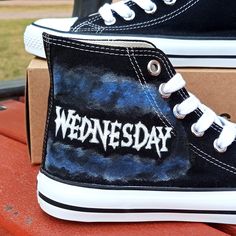 "⭐ FREE SHIPPING ⭐ These one-of-a-kind Wednesday Addams painted shoes are sure to add a touch of edgy style to any outfit. Our skilled artists have hand-painted a detailed design set against a crisp white background, making Wednesday's dark and moody features stand out all the more. Not only are these shoes super fashionable, but they're also made with high-quality materials to ensure maximum comfort and durability. The canvas upper and rubber sole provide a breathable and flexible fit, while th Black Hand Painted Custom Sneakers With Round Toe, Artsy Sneakers With Rubber Sole And Round Toe, Artistic Customizable Sneakers With Round Toe, Artistic Customizable Sneakers, Hand Painted Canvas Shoes With Round Toe, Hand Painted Round Toe Canvas Shoes, Hand-painted Canvas Shoes With Round Toe, Wednesday Addams Shoes, Wednesday Shoes