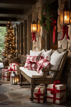 a porch decorated for christmas with presents and lights