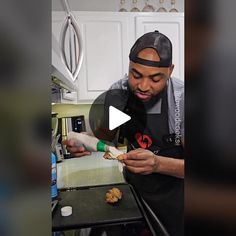 a man in an apron is making cookies