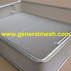 an empty metal container sitting on top of a cardboard box with the words general mesh