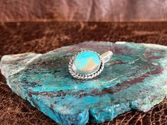 We love Hat Tokens! This token is made of sterling silver & beautiful Royston Turquoise with twist wire trim. These tokens attach to your hat leaving no holes or damage. This token could also be attached to other accessories/items, and could also be worn as a pendant on beads or chains. We are excited to offer this unique piece! Adjustable Sterling Silver Turquoise Ring In Western Style, Adjustable Oval Western Style Turquoise Ring, Adjustable Oval Turquoise Western Ring, Royston Turquoise, Love Hat, Twisted Wire, Rope Design, Adjustable Ring, Adjustable Rings