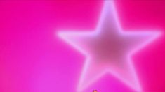 a man standing in front of a star on a pink background with white light shining through it