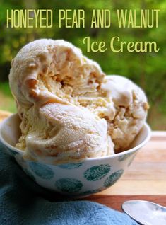 two scoops of ice cream in a bowl on a table with the words honeyed pear and walnut ice cream