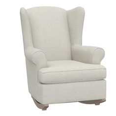 a white chair with a wooden base and arm rests against a white background, it appears to be upholstered