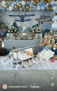 a baby's room decorated with balloons and teddy bears