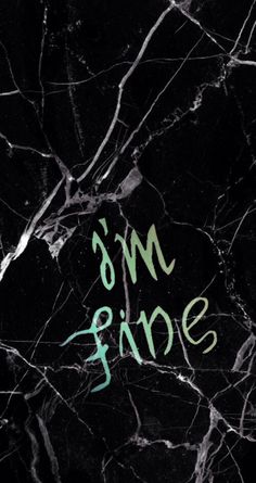 marble with the words ms fine written in green ink on it's black background