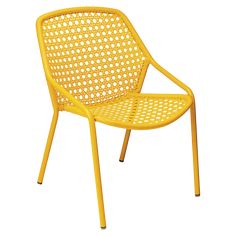 a yellow plastic chair sitting on top of a white floor