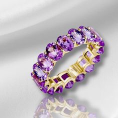 💎 Product Detail: *Metal: 14K Solid Gold *Gemstone: Amethyst     - Cut: Oval      - Color: Purple      - Clarity: Eye-Clean      - Size: 4 x 6 mm      - Total Carat Weight (CTW): 7.60     - Band Width: 6 mm 💓 Why You'll Love It: The Eternity Royal Purple Oval Amethyst Ring is a magnificent blend of regal elegance and timeless beauty. Featuring exquisite oval-cut amethysts that encircle your finger, this ring creates a continuous band of rich, royal purple brilliance. The 14K solid gold band ad Oval Amethyst Multi-stone Ring In Yellow Gold, Oval Amethyst Ring For Anniversary, Oval Amethyst Ring, Regal Elegance, Solid Gold Band, Solid Gold Ring, Etsy Gold Ring, Hand Ring, Solid Gold Rings