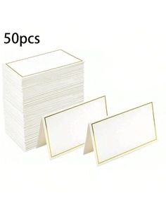 50 sheets of white paper with gold trim