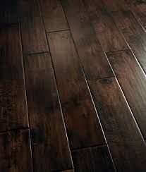 a wooden floor that has been cleaned and is brown with wood grains on it