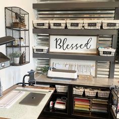 a sewing room with lots of crafting supplies on the shelves and baskets hanging from the wall