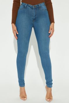 Say hi to your waist as you slip into our best-selling flexible stretch denim pants. The Classic High Waist Skinny Jeans feature a dark wash, 2 back pockets, 2 faux front pockets, a zip fly closure, and are available in Curve. Providing a seamless transition from day to night, these jeans are a wardrobe essential. Available In Multiple Washes Available in Petite 28" Inseam, Regular 31" Inseam, & Tall 34" Inseam 11" High Rise Skinny Jean High Stretch Faux Front Pockets Functional Back Pockets Dis Fitted Medium Wash Jeggings With Pockets, Tight Denim Blue Bottoms, Blue Mid-rise Jeggings With Pockets, Tight Straight Leg Blue Jeans, Blue Tight Straight Leg Jeans, Tight Blue Straight Leg Jeans, Flattering Outfits, Stretch Denim Pants, Curve Jeans