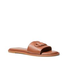 Michael Kors-Saylor Sandal Grabbing coffee with friends? Give your casual look a chic twist with the Michael Michael Kors Saylor sandal. The slide sandal, made using sustainable leather, has a debossed empire patch that can elevate any look. Brown Summer Mules For Everyday Wear, Brown Open Toe Slides For Everyday, Leather Sandals With Leather Footbed For Travel, Brown Slides With Leather Footbed For Everyday, Brown Slides For Everyday Spring Wear, Brown Spring Slides For Everyday Wear, Trendy Brown Leather Slides, Casual Brown Sandals For Travel, Casual Brown Travel Sandals