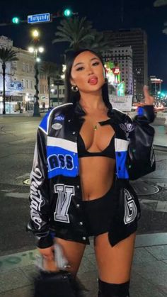 Blue Racing Jacket Outfit, Street Racer Fashion, Racer Jacket Mini Skirt, Race Car Rave Outfit, Outfit With Racer Jacket, Racing Bomberjack Outfit, Race Car Style Outfits, Race Car Driver Jacket Outfit, Blue Racer Jacket Outfit