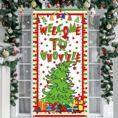 a welcome sign hanging from the side of a window in front of christmas decorations and garlands