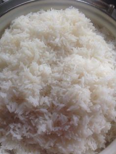 white rice is in a bowl on the stove