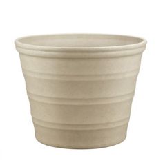 a white ceramic pot is shown on a white background