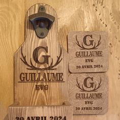 a bottle opener and some coasters on a wooden surface with the name gullaume evg