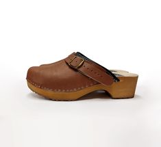 MADE FROM LEATHER AND ALDER WOOD Clogs for Women BONDA Low heals ergonomic wooden sole and soft leather. made to order. Available in sizes 36-41. For other sizes please contact me EUR 35 l UK 2.5 l AUS 4.5 l USA 5 l up to 22.3cm l 8.78 inches EUR 36 l UK 3.5 l AUS 5.5 l USA 6 l up to 23cm l 9.02 inches EUR 37 l UK 4 l AUS 6 l USA 6.5 l up to 23.7cm l 9.33 inches EUR 38 l UK 5 l AUS 7 l USA 7.5 l up to 24.5cm l 9.65 inches EUR 39 l UK 6 l AUS 8 l USA 8.5 l up to 25.3cm l 9.96 inches EUR 40 l UK 7 Natural Color Slip-on Clogs With Wooden Heel, Spring Wooden Heel Slip-on Clogs, Open Toe Wooden Clogs With Cork-bed Midsoles, Wooden Slip-on Clogs With Wooden Heel, Brown Mules, Brown Clogs With Buckle Closure, Medium Width, Swedish Clogs, Clogs And Mules, Clog Boots