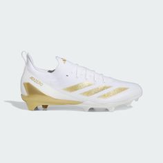 the adidas soccer shoe in white with gold detailing on the upper and bottom part