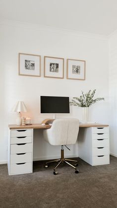 a white desk with drawers and a computer on it