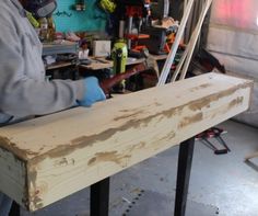 a man working on a piece of wood