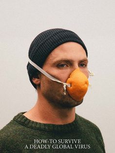 a man with a knife through his mouth and an orange in front of his face