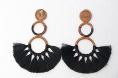 Black & Tan Palm with Tassels Earrings - Handmade - Black & Brown Measurements: 3.5 in Long - This earring is Completely handmade using iraca Palm and Tassels - Elegant & High Quality - ⭐️Shipping: DHL : * USA, Central & North America: 2-3 Business Days * Rest of The World: 4-6 Business Days - Earrings Handmade Earrings Straw earrings Flower earrings Tassels Earrings Gold Earrings Colorfull pink earrings Black Handwoven Jewelry For The Beach, Black Handwoven Jewelry For Beach, Handwoven Black Jewelry For The Beach, Black Round Summer Jewelry, Black Bohemian Woven Jewelry, Black Woven Bohemian Jewelry, Traditional Black Tassel Earrings, Black Handwoven Dangle Earrings, Handmade Black Earrings For Beach