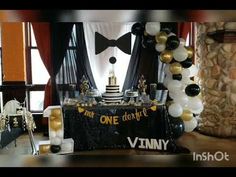 a black and gold themed party with balloons