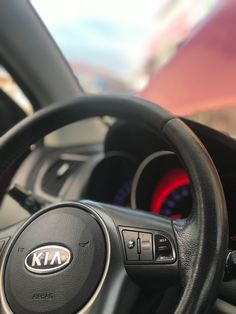 the steering wheel and dashboard of a car