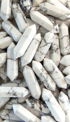 several pieces of white marble are stacked together