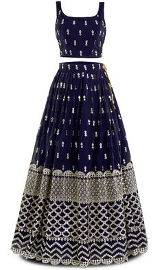 Navy never looked so fly! With mirror work that shines brighter than diamonds, this 3 piece lehenga screams elegance. Get ready to slay, because this lehenga doesn't just turn heads, it stops traffic. Elegant Party Lehenga With Gota Work, Party Wear Festive Sharara With Gota Work, Festive Party Wear Sharara With Gota Work, Elegant Floor-length Skirt Set With Zari Work, Elegant Designer Skirt Set With Zari Work, Traditional Semi-stitched Skirt Set For Party, Elegant Designer Zari Work Skirt Set, Festive Elegant Saree Skirt Set, Traditional Skirt Set For Eid Party