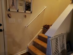 a staircase with pictures hanging on the wall