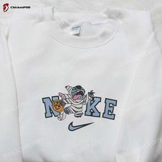 Introducing the Nike x Mummy Stitch Embroidered T-shirt, a fusion of style and comfort. This trendy tee showcases a unique collaboration between Nike and the beloved Disney character, Mummy Stitch. With intricate embroidery, the design brings this mischievous yet adorable character to life. Made from high-quality fabric, this t-shirt guarantees a soft and breathable feel, [...] Nike Cartoon, Nike Inspired, Mocha Bear, Cartoon Hoodie, Maroon Hoodie, Embroidered Shirts, Mike Wazowski, Corpse Bride, Perfect Family