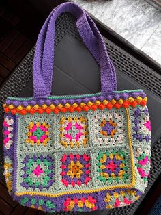 a crocheted bag sitting on top of a table