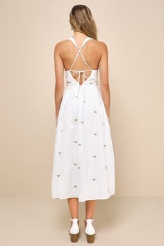 The Lulus Delicate Excellence White Floral Embroidered Tie-Back Midi Dress has so many darling details that make it the perfect spring look! Feminine floral embroidery (in hues of white, green, and yellow) decorates lightweight woven cotton as it shapes a crochet lace-trimmed V-neckline and a sleeveless bodice with seam detailing and flattering gathering, supported by wide straps that taper into long laces that tie above a cute open-back cutout. The fitted waist features chic pleated detailing a Feminine Cotton Midi Dress With Floral Embroidery, Spring Floral Embroidered Midi Dress For Day Out, Floral Embroidered Midi Dress For Spring Day Out, Floral Embroidery Midi Dress For Day Out, Floral Embroidered Midi Dress For Day Out, Spring Floral Embroidery Midi Dress For Day Out, Spring Floral Applique Midi Dress For Garden Party, Sleeveless Floral Embroidery Midi Dress For Daywear, Sleeveless Midi Dress With Floral Embroidery For Daywear