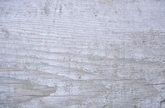 an old white wooden surface with peeling paint