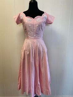 Super sweet pink 1950s handmade one of a kind dress. Gemstone decals throughout with a scalloped neckline. Super soft material. No size listed but measurements seem to place it at a small, our mannequin is a size 4 and it fit very snug. Some discoloration shown in pictures. The yellow spot is on the inside of the dress and won't show when worn, the tops of the shoulders have some discoloration on the white edge. We soaked the dress in Oxiclean but couldn't quite get those out. If hair was down it wouldn't be noticed and they really aren't super obvious on their own. Belt loops on dress but no belt with it, not necessary in our opinion. Measurements  Waist: 25" Chest: 32" Shoulder to bottom hem: 44" Super Sweet, Lovely Dresses, Dress Clothes For Women, Fitness Inspo, Wearable Art, Dress Outfits, Womens Dresses, Crystals, Clothes For Women