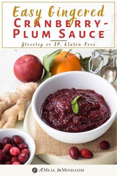 cranberry - plum sauce in a white bowl surrounded by fresh fruit