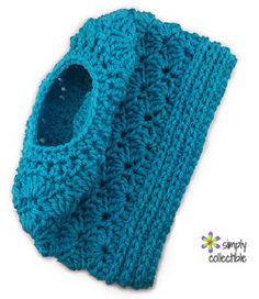 a blue crocheted scarf with a hole in the middle