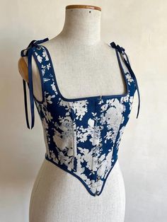 Stays Corset made of denim  cotton with floral motif  (floral motif have washed effect ) ✨busk fastening at the front  ✨lacing at the back ✨straps with ribbon  ✨cotton lining ✨ stainless steel eyelets ✅SIZE  available in one copy corset will fit parameters  bust 33,4-35,8 inch (85-91 cm),  waist 24,4-26,7 inch (62-68 cm) Blue Summer Corset Dress With Boned Bodice, Floral Print Overbust Corset With Fitted Bodice, Vintage Floral Print Summer Corset, Vintage Floral Print Fitted Corset, Vintage Fitted Floral Print Corset, Fitted Vintage Floral Print Corset, Vintage Overbust Floral Print Corset, Vintage Floral Print Overbust Corset, Vintage Overbust Corset With Floral Print