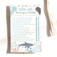 a baby shower game with an ocean theme on the front and back cover, along with instructions for how to use it