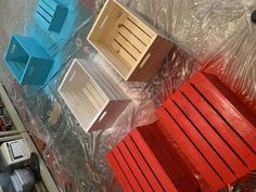 four wooden chairs sitting on top of plastic