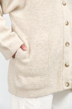 The Fleece Cardigan is an oversized button up cardigan with an elegant drop shoulder and v-neck design, and two large side pockets. This cozy cardigan is perfect for going into fall and winter months. Oversized Beige Cardigan With Button Closure, Oversized V-neck Cardigan With Buttons, Oversized Button-up Cardigan With Button Closure, Cozy Beige Button-up Cardigan, Beige Button-up Cozy Cardigan, Fleece Cardigan, Button Up Cardigan, Lauren Manoogian, Tassel Scarf